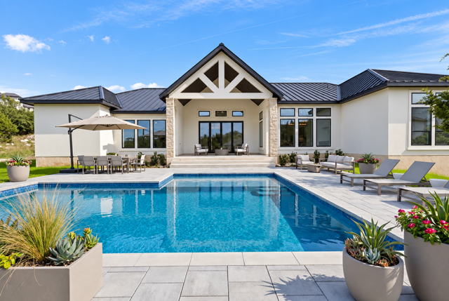 Custom home with a swimming pool and outdoor living space in The Canyons at Scenic Loop in San Antonio 