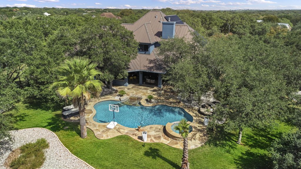 Aerial View of luxury home with swimming pool in Shavano Park TX